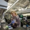 Women with pipettes working in lab.
